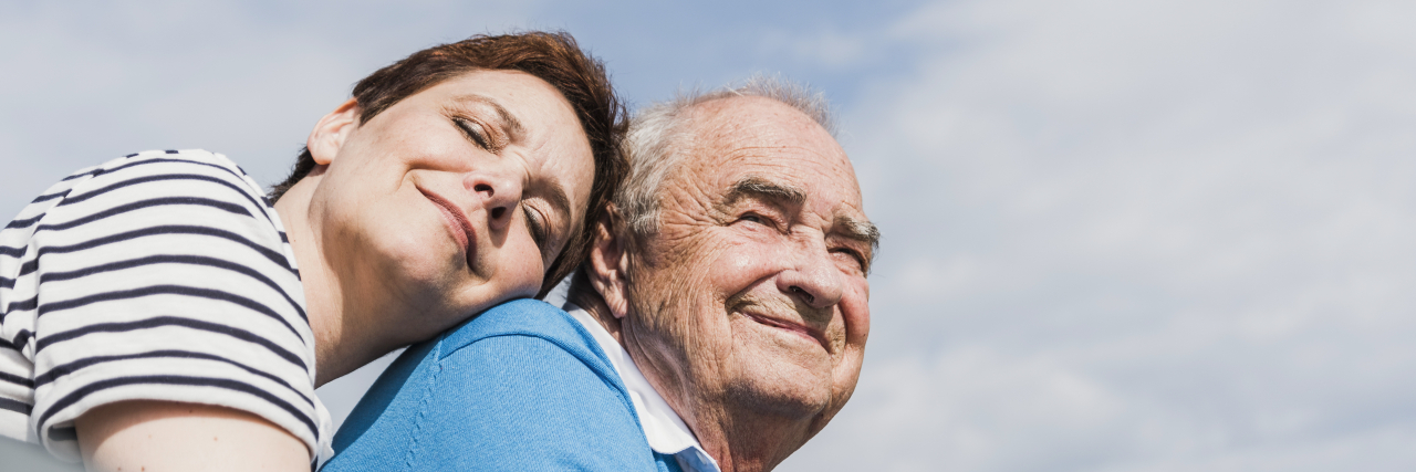 How Parenting With a Chronic Illness Changes as Your Kids Grow Older Woman hugging her father.