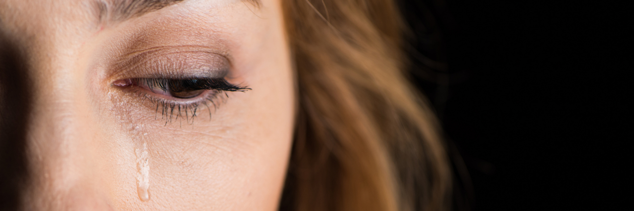 My Panic Disorder Made Me Fear Attending My Grandpa’s Funeral Close-up view of young crying woman's face