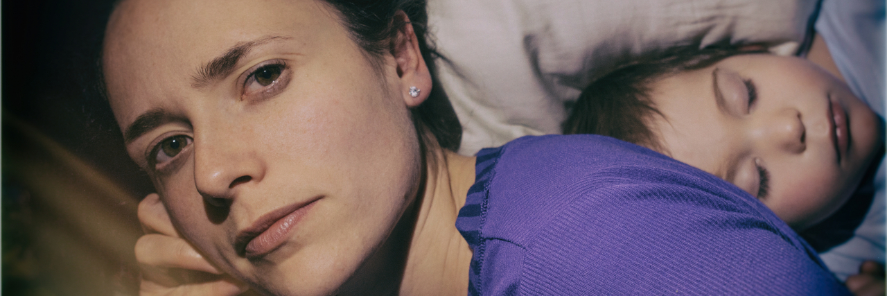 How Burnout Impacts Me as a Parent With Depression Tired mother with daughter.