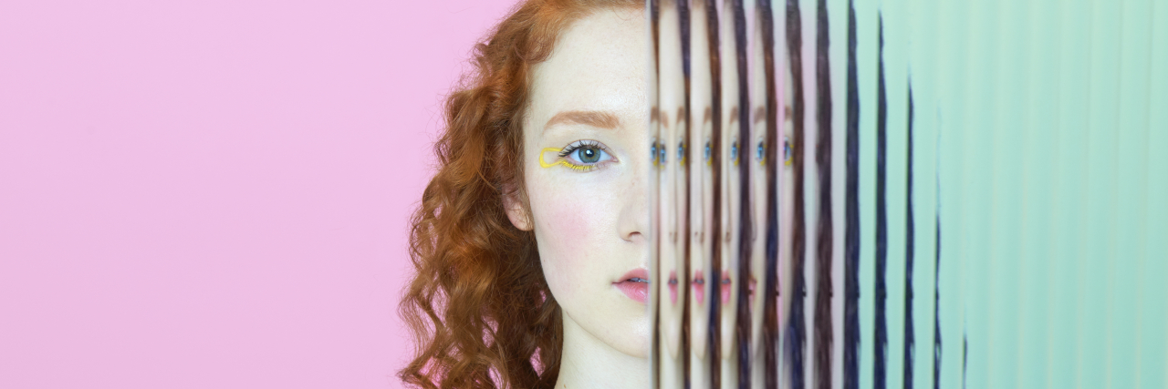 Is It a Hidden Disability or an Invisible Disability? Half of woman's face obscured by glass.