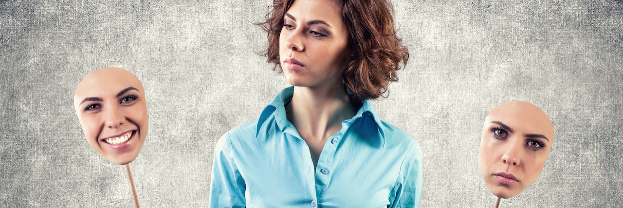 How I Radically Accepted My Therapist Was Retiring A woman holding two masks. One is happy and one of sad