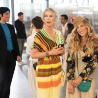 "Sex and the City" Carrie (Sarah Jessica Parker), Charlotte (Kristin Davis), and Miranda (Cynthia Nixon) standing together smiling