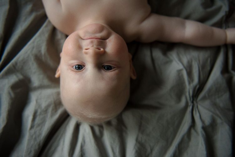 The author's son, who has blonde hair and blue eyes, as an eight-month-old baby.