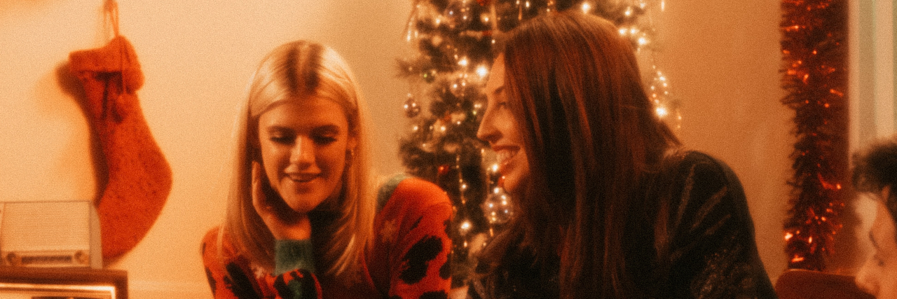 photo of friends at christmas exchanging presents
