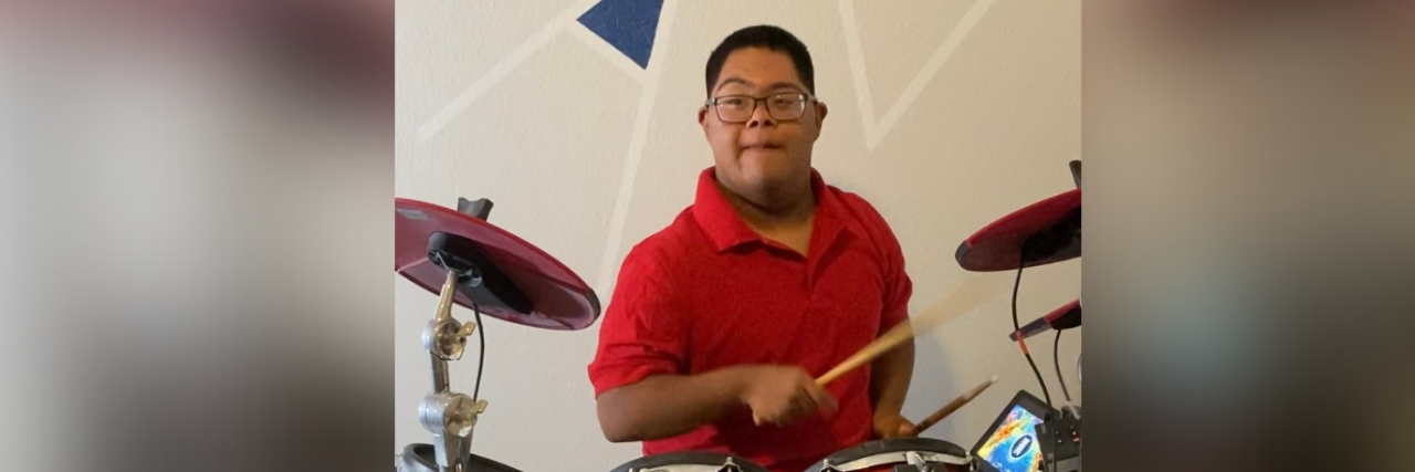 What Rudolph the Red-Nosed Reindeer Teaches Us About Disability Raymond playing drums.