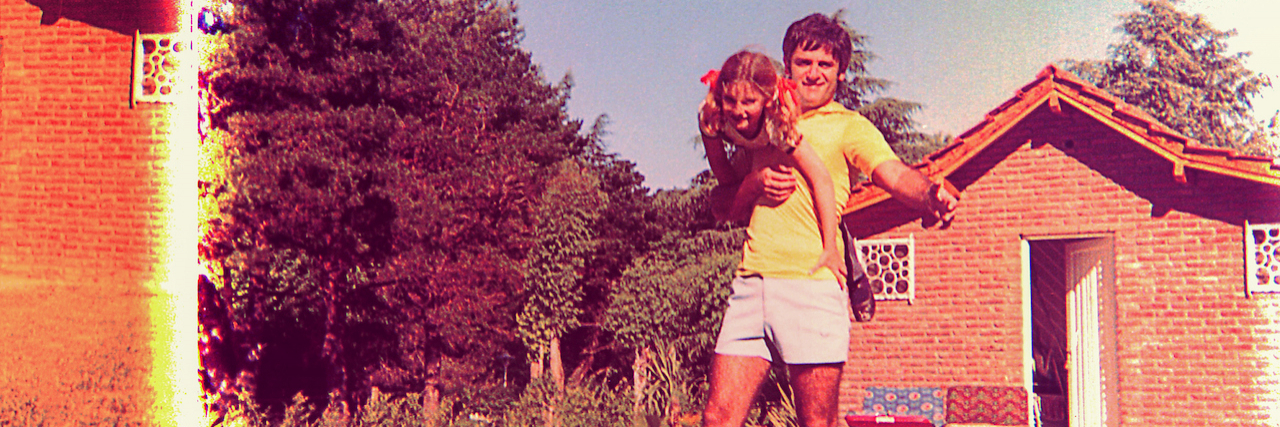 A Letter to My Dad, One Year After His Suicide Vintage and damaged photo of a girl and her father playing outdoors