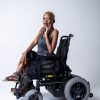 Black fashion model who uses a power wheelchair.
