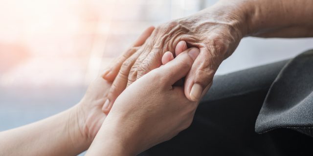 two sets of intertwined helping hands