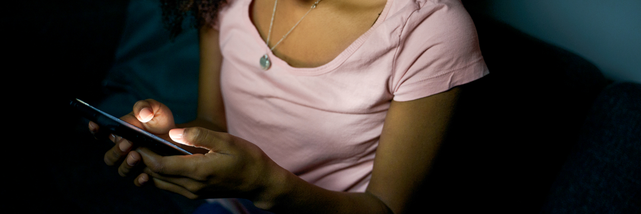 Why Your Depression Gets Worse at Night, And How to Cope Lonely girl texting on mobile phone late at night