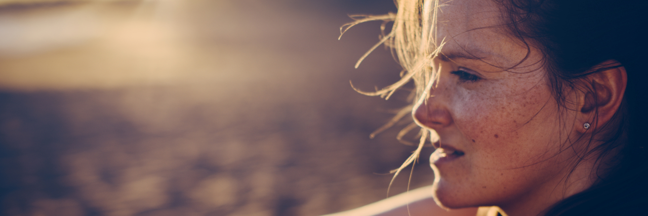 Borderline Personality Disorder or Autism? How About Both? Woman looking at the sunset.