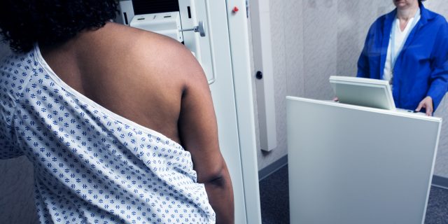 Woman getting mammogram.