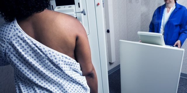 Why I Dread but Never Skip My Annual Mammogram as a Black Woman Woman getting mammogram.
