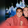Author and his partner taking a selfie in front of the Disneyland castle, smiling