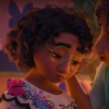 A still from Disney's "Encanto" where Mirabel, a young colombian girl is being tended to by her mother. Mirabel looks sad and her mother is comforting.