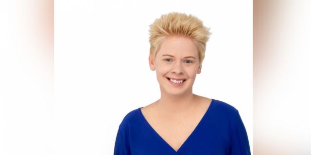 Image of contributor smiling in front of a white background
