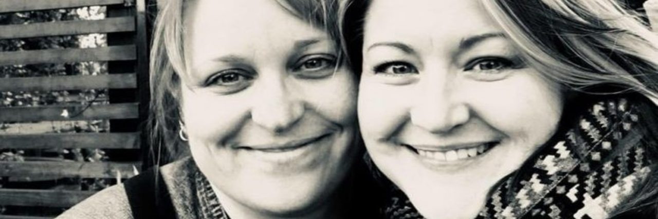 Struggling With Friendships Because of an Anxiety Disorder Black-and-white photo of two white women wearing coats and standing beside each other,