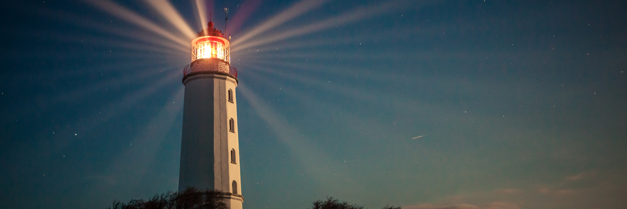 a lighthouse shining