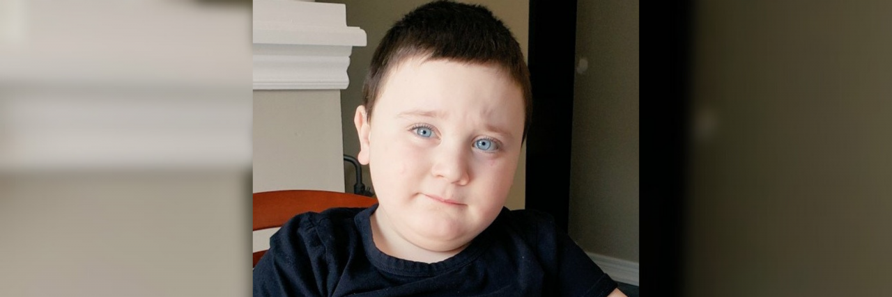 I Won't Give Up on You, My Son on the Autism Spectrum Max playing with sand in a tray.