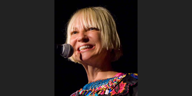 I'm Sorry Sia Has Been Suicidal, but It Doesn't Erase the Harm She Caused to Autistic People Sia singing in a 2011 photo.