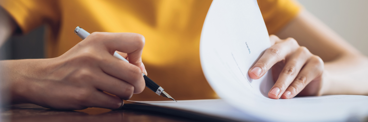 What to Do Before a Mental Health Emergency Woman filling out paperwork