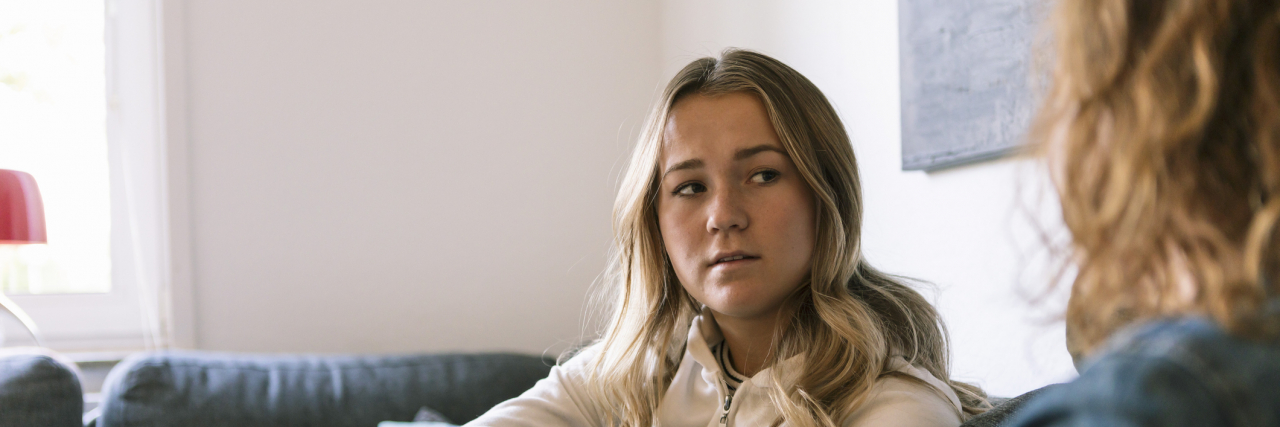 Seeking Reassurance for My 'Taboo' OCD Obsessions Made Them Worse Teenage daughter talking to mother while sitting at home