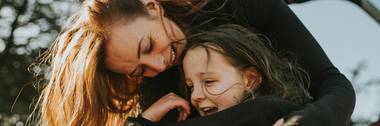 5 Ways Single Parents of Kids on the Autism Spectrum Can Manage Stress Mother hugging daughter.