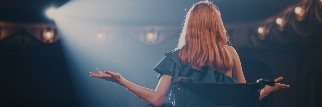 Why Performing Stage Combat With Cerebral Palsy Was a Real Battle Young woman in wheelchair on stage.