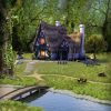 Idyllic fantasy fairytale cottage hidden in a deep forest.