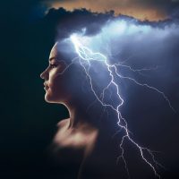 Woman with lightning bolts shooting from her head.