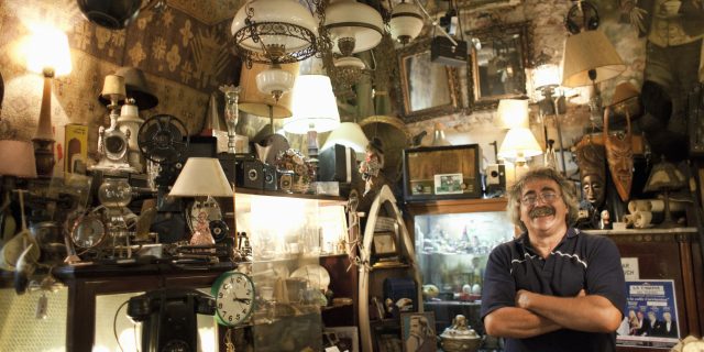 Antique store owner in his shop.