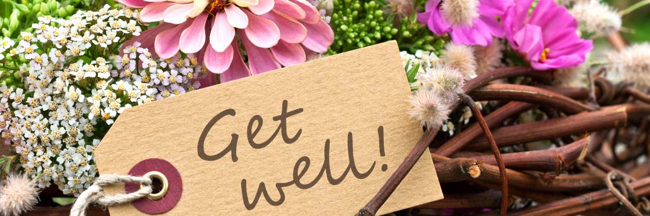 Why 'Get Well Soon' Culture Isn’t Helping Anyone Heal pink flowers and card with lettering "get well"