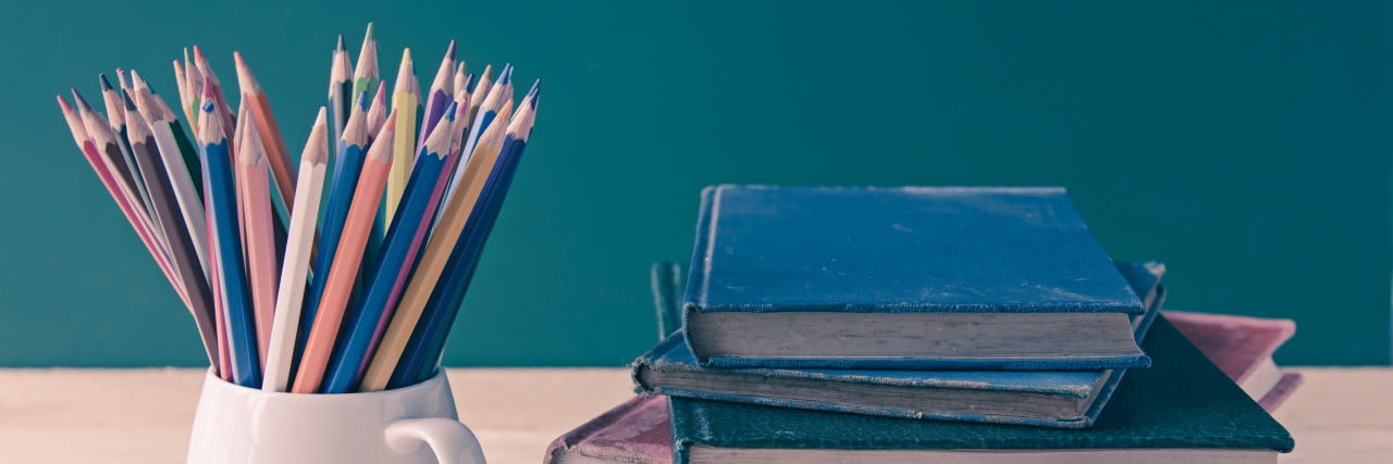 It Shouldn't Be So Hard to Get Disability Accommodations at University Textbooks and pencils on table.