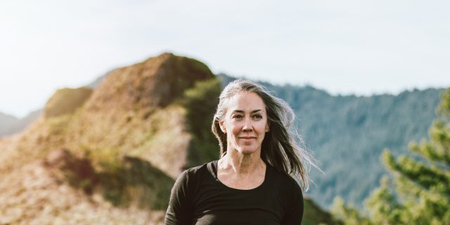 The Challenges of Intimacy When You Have Cloacal Exstrophy Middle-aged woman with mountains in background.