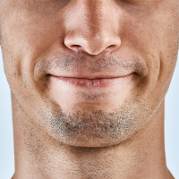 Mouth of man, close up.
