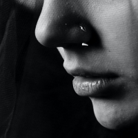 black and white close up photo of a woman's tears and lower face