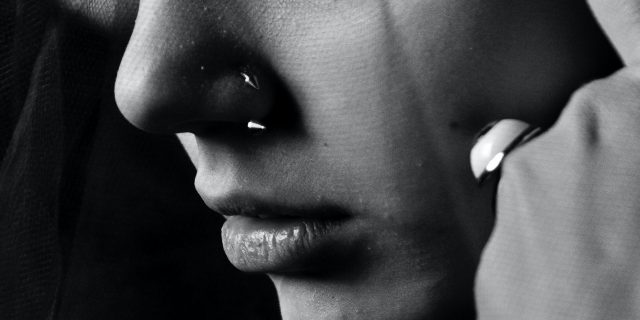 Loss of Smell From COVID-19 Has a Deeper Impact Than You Think black and white close up photo of a woman's tears and lower face