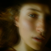 photo of a woman blurred looking into camera