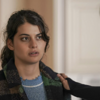 Sofia Black-D’Elia in "Single Drunk Female" looking disheveled, with another character's hand on her shoulder