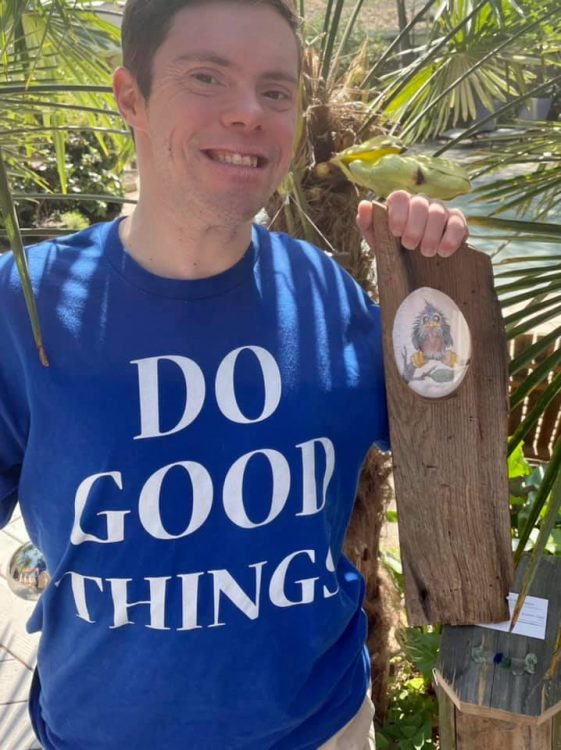 Stephen Todd wearing a blue t-shirt that says Do Good Things.