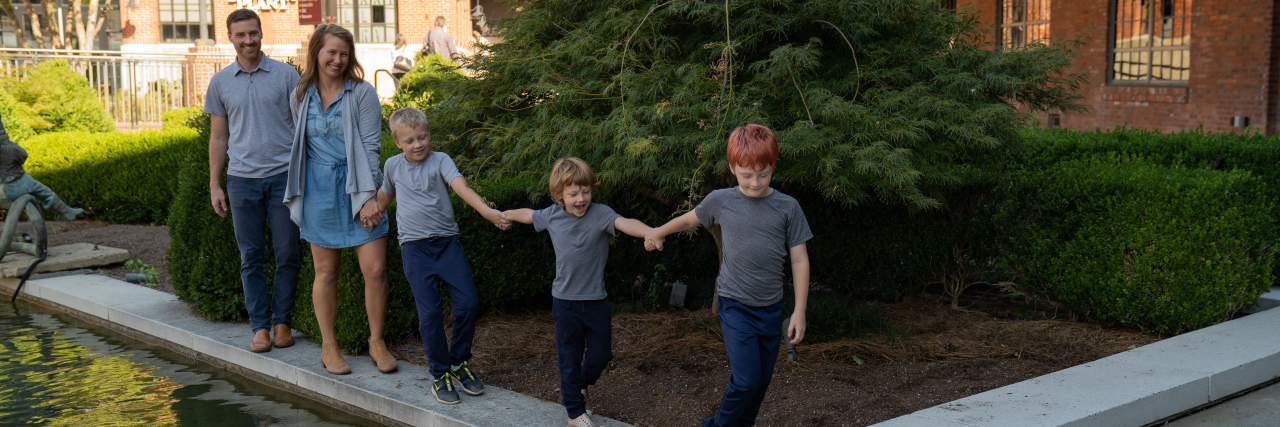 How I Learned to Listen to My Autistic Child, Not Parenting 'Experts' Amanda with her husband and children.