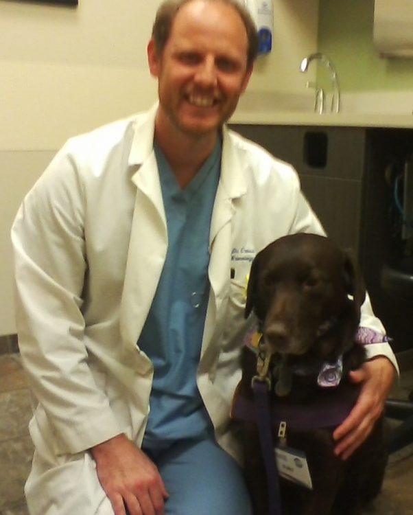 Ruby with her veterinarian.