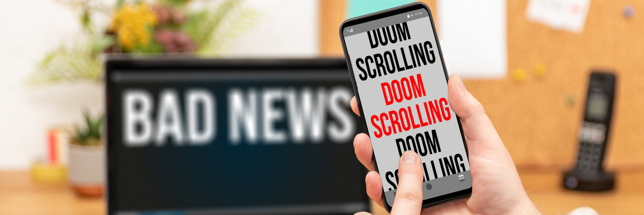 "Doom scrolling" on a smartphone and bad news on laptop