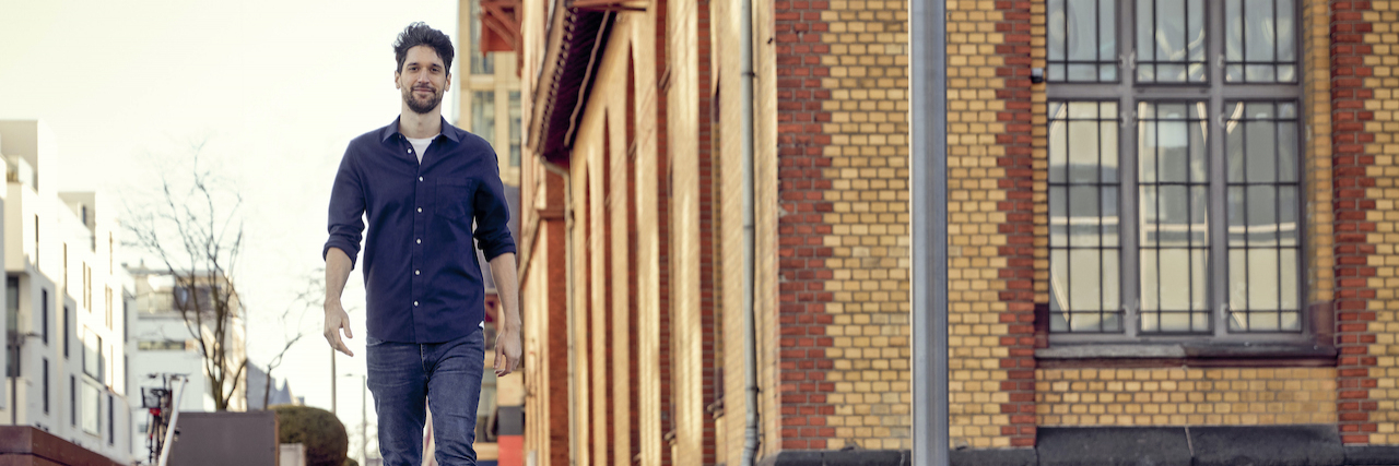 How Mindfulness Plays a Role in Managing My Schizophrenia Man enjoying a walk in a city