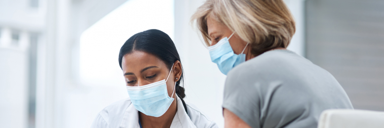 Taking Care of Your Medical Health When You've Experienced Trauma Doctor talking to patient