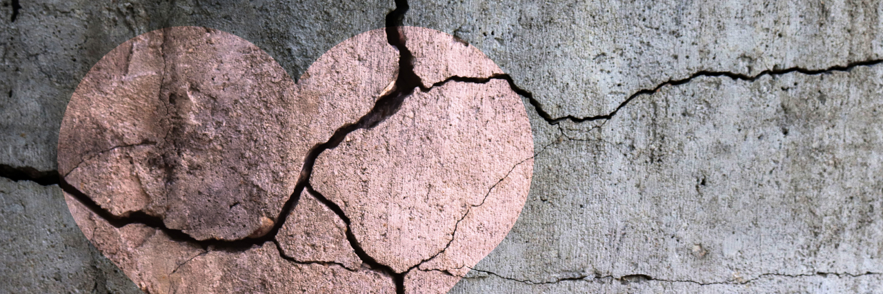 Remembering All the Times I Thought About Leaving You Drawing of a heart on a cracked wall.