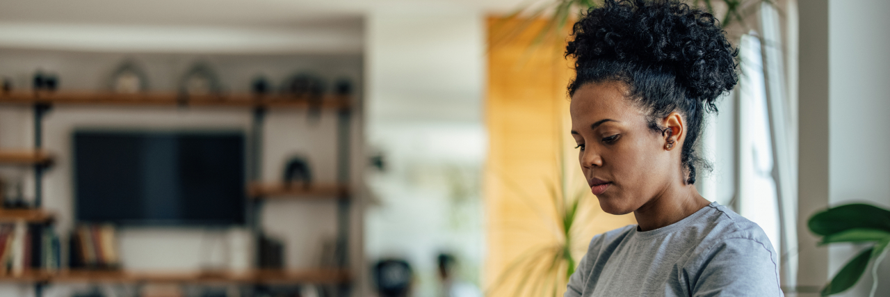 I Disclosed My Suicide Attempt in My Job Application Process Ambitious adult woman, writing a document, on her laptop, at home