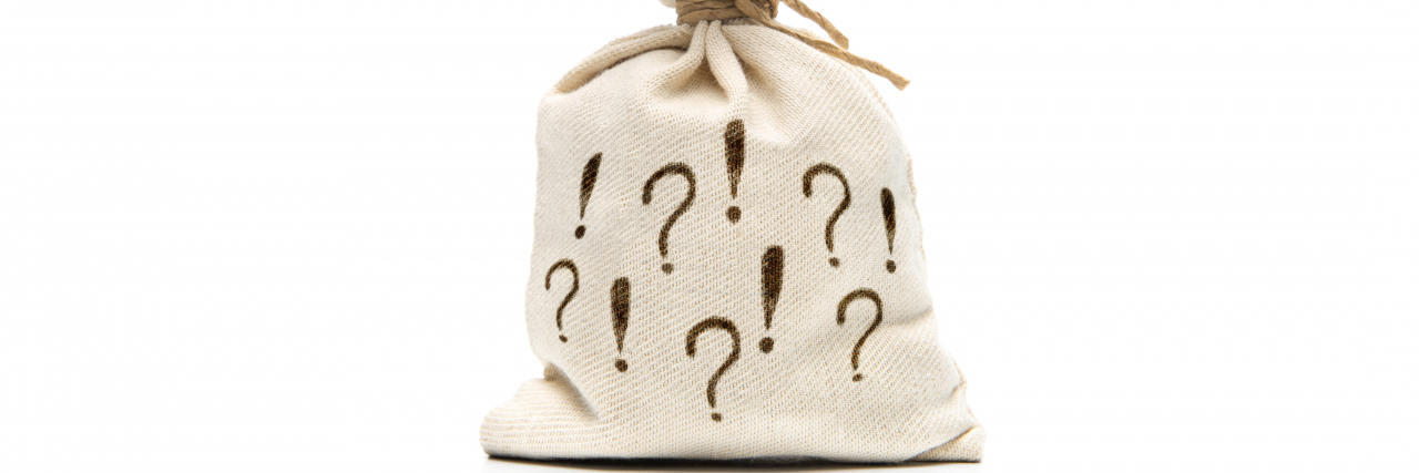 Not Quite Autistic: What's in My Neurodiversity Grab Bag Neurodiversity grab bag with question and exclamation marks.