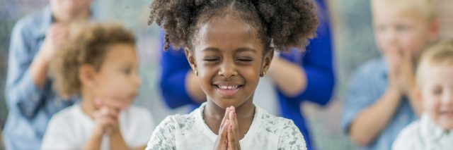 Children praying in Sunday school