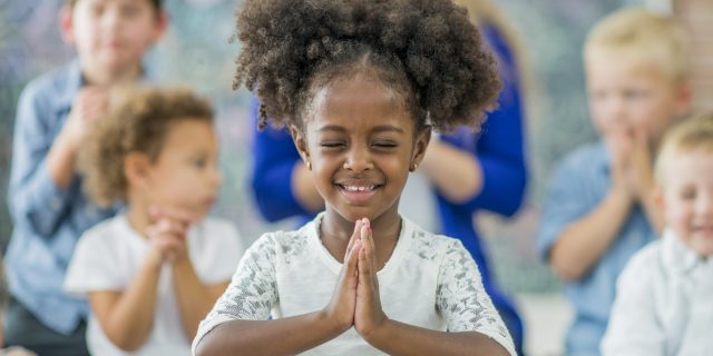 Children praying in Sunday school