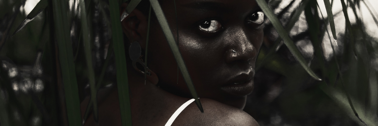 Florida's Don't Say Gay Bill Could Harm Sexual Abuse Survivors photo of a person looking over shoulder into the camera